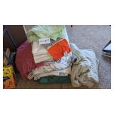 Large stack of bedding