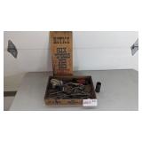 Hooks, sign, brass shell case, misc.