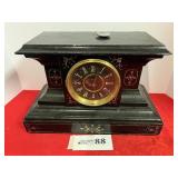 Unknown black mantel clock w/painted face