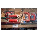 Tin snips, grease gun, C-clamps, large drill bit