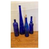 Four Blue Bottles