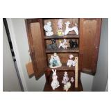 Contents of Hall Cabinet. Mostly Dog Figurines.
