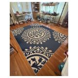 8x10 aerial rug, made by Safavieh    Needs