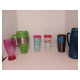 Assortment of Plastic Cups and Thermos