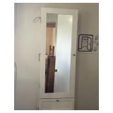 On wall jewelry cabinet.  14x40