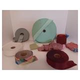 spools of ribbon and fabric trim for crafts or