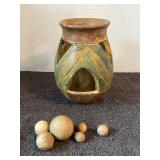 Clay vase and marbles