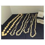 Assortment of shell and kukui nut necklaces from