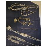 Assortment of costumes necklaces and a bracelet