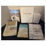 Assortment of books and furniture leg cups
