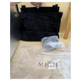 black Miche handbag base with accompanying straps