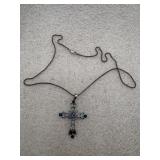 Lia Sophia cross pendant necklace featuring blue
