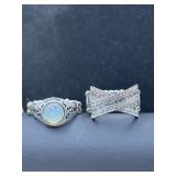 white metal ring with an opal-like stone and a