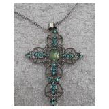 ornate cross pendant necklace featuring teal