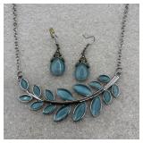 jewelry set featuring blue stones on a