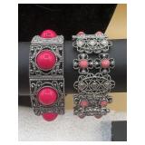 silvertone stretch bracelets featuring hot pink
