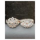 two costume jewelry rings, one featuring a lotus