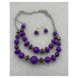 Upscale Chic' purple necklace and earring set.