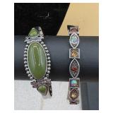 bracelets, one featuring a large olive green