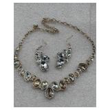 gold-toned jewelry set features a rhinestone