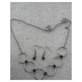 Regal Society' model in red, featuring a necklace
