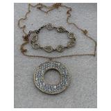 large circular pendant necklace and a matching