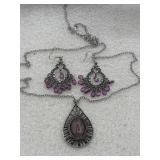 All-Girl Glow' purple earrings, which feature a