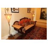Cane-Back Settee with carved wood frame
