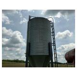 Corrugated Metal Grain Bin with Ladder. Has about a ton of corn in it.