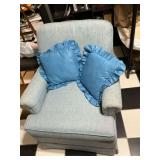 Comfortable Light Blue Armchair with Accent Pillows