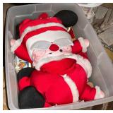 Assorted Items in Totes: Plush Santa, Fur Pieces, Cake Molds, and Costumes
