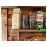 Shelf with Milk Cartons, Glassware, and More