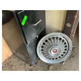Metal File Cabinet and Ford Mustang Wheel Cover