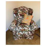 Floral Upholstered Wingback Chair with Decorative Needlepoint Pillow