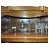 Assorted Glassware Collection Including Stemmed Goblets and Lidded Jars
