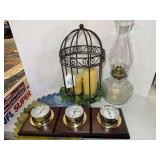 Assorted Home Decor Lot Including Weather Station, Oil Lamp, and Painted Saw Blade