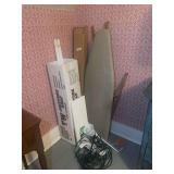 Household Items Including Projector Screen, Ironing Board, and Lighting