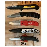 Another 5 knives on display rack brands are visible