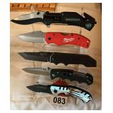 5 knives on display rack folders