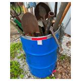 Barrel full of shovels, rakes, scoops, pick and more (holes in barrel)