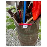 Barrel full of tools - shovels, scrapers, rakes and more (barrel has holes)