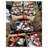Several totes of 4 inch PVC Sch. 40 glue fittings