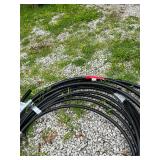 2 small rolls of 1-1/4 inch and 1 inch HDPE pipe