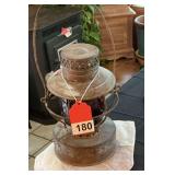 Antique St. Louis Railroad lantern with red lens, lens has a crack
