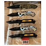 5 new folding knives on display rack
