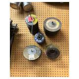 Lots of grinding discs and cutting discs, 7 inch, 4-1/2 inch, 4 inch, 3 inch +++ with most of the 7 and 7-1/2 inch tapped 5/8 inch