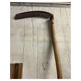 Seymore bush Scythe with a RIXFORD blade, about 90% of its metal remaining, most of its original red paint, made about 1949