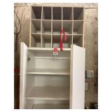 6 shelf really nice cabinet with doors and a 15 cubby hole cabinet included