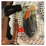1 Eastwing Sportsman Hatchet with leather sheath, and a Stihl PS 30 pruning saw