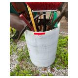 Plastic barrel full of tools - shovels, hoes, pick, car wash brushes and more (holes in bottom of barrel)